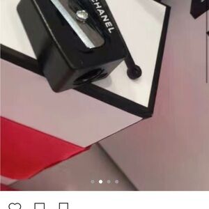 CHANEL Black Pencil Sharpener with Red Accent